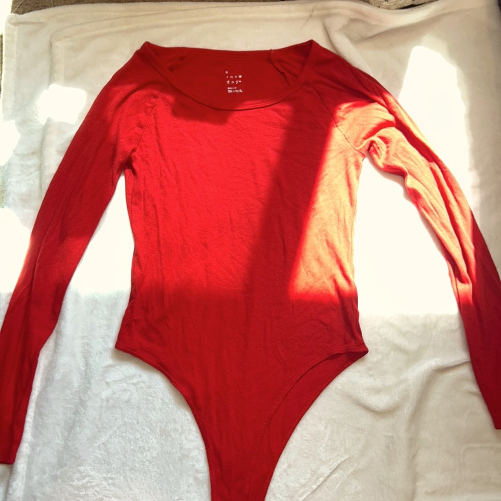 “a new day” red long sleeve body suit, size M
